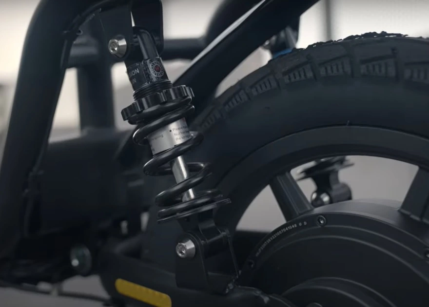 Electric scooter parts motor and shocks are showing in picture